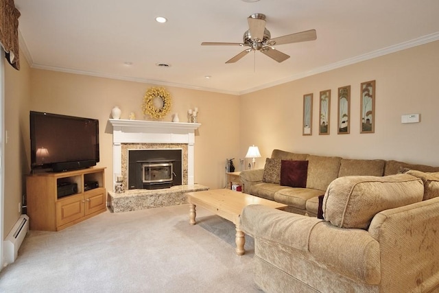 living room featuring a baseboard radiator, ceiling fan, crown molding, and carpet floors