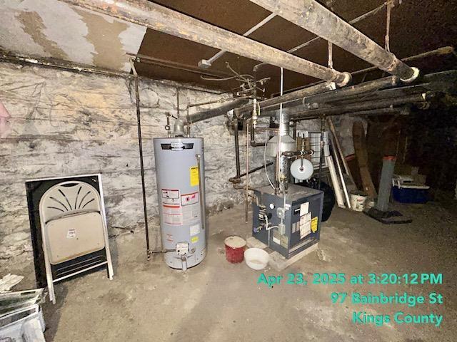 unfinished basement featuring a heating unit and gas water heater
