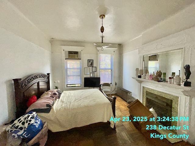 bedroom featuring radiator