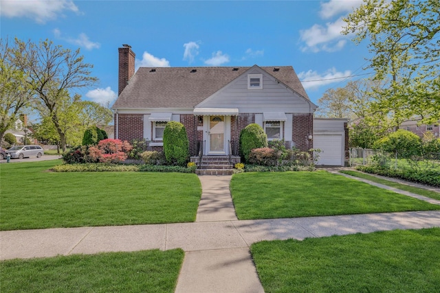 view of front facade with fence, a chimney, a front lawn, and brick siding