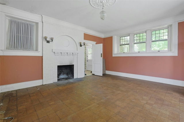 225 River Rd, Nyack, NY 10960 - unfurnished living room with baseboards, crown molding, and a brick fireplace