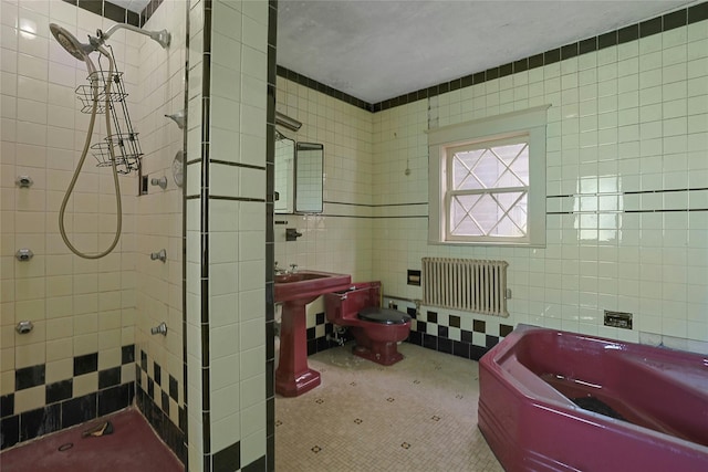 225 River Rd, Nyack, NY 10960 - full bath with radiator, tile walls, toilet, tiled shower, and a garden tub
