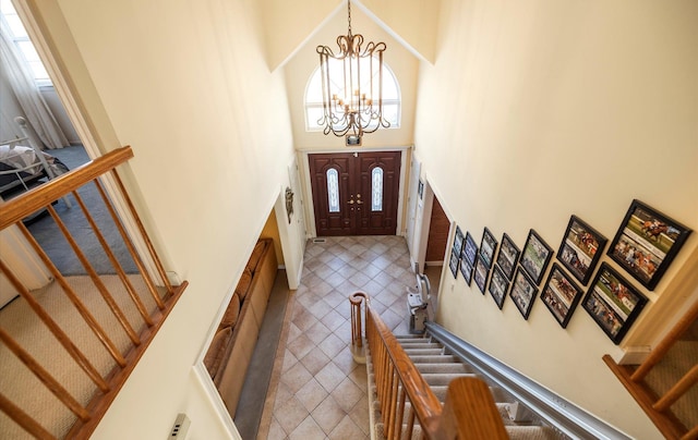 100 Glen Cove Rd, Greenvale, NY 11548 - entryway with stairs, a towering ceiling, and a chandelier
