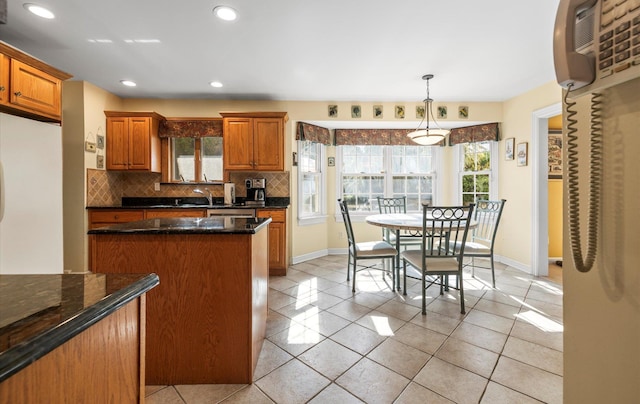 100 Glen Cove Rd, Greenvale, NY 11548 - kitchen with freestanding refrigerator, baseboards, recessed lighting, tasteful backsplash, and light tile patterned floors