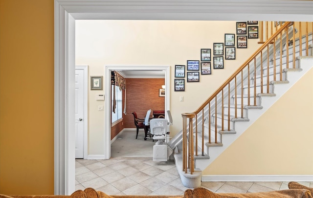 100 Glen Cove Rd, Greenvale, NY 11548 - stairway featuring crown molding, tile patterned floors, baseboards, and carpet flooring