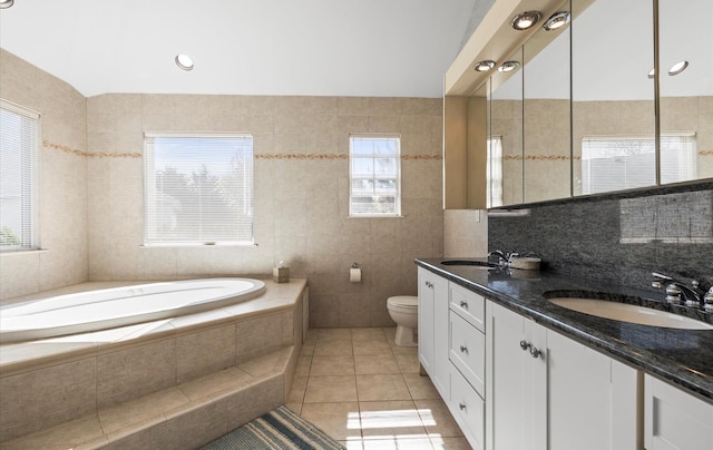 100 Glen Cove Rd, Greenvale, NY 11548 - full bath featuring a sink, tile patterned flooring, toilet, tile walls, and a bath