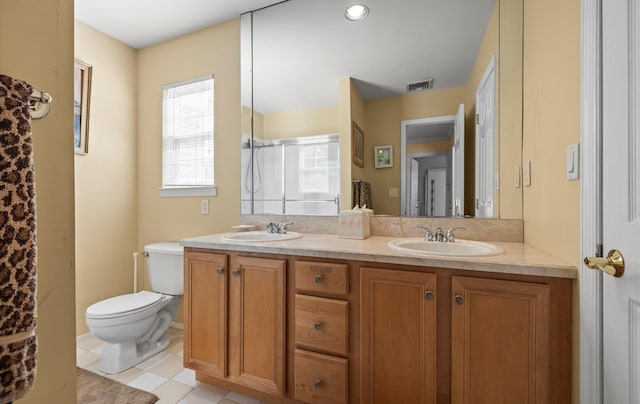 100 Glen Cove Rd, Greenvale, NY 11548 - bathroom with a sink, a shower stall, toilet, and double vanity