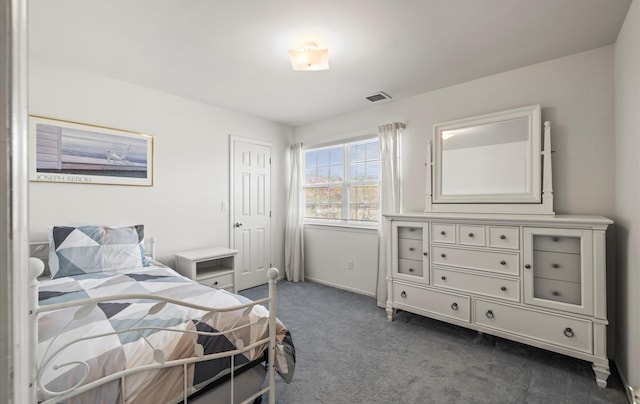 100 Glen Cove Rd, Greenvale, NY 11548 - bedroom with baseboards, visible vents, and dark colored carpet