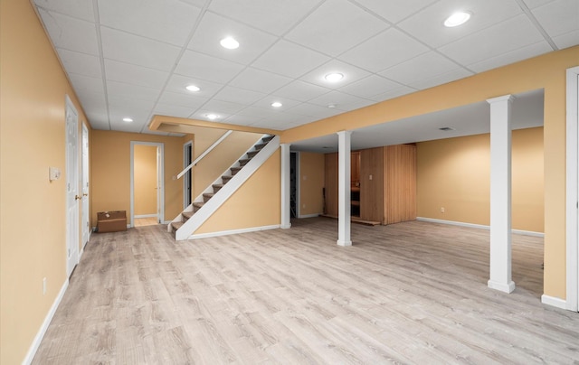 100 Glen Cove Rd, Greenvale, NY 11548 - finished basement with baseboards, a drop ceiling, stairway, recessed lighting, and light wood finished floors
