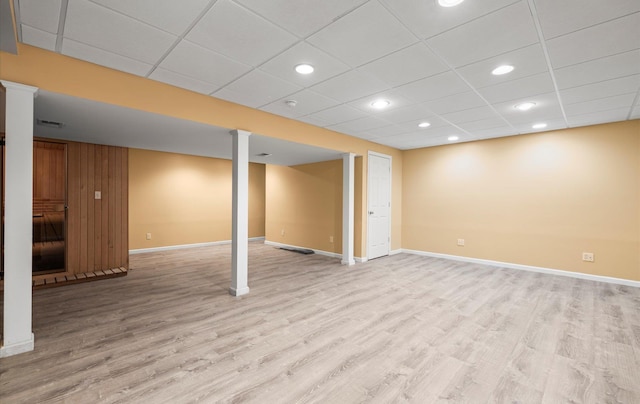 100 Glen Cove Rd, Greenvale, NY 11548 - finished basement with recessed lighting, baseboards, light wood-type flooring, and a paneled ceiling