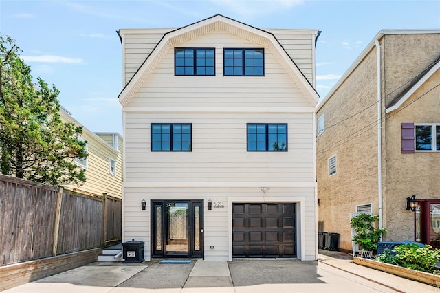 923 Oceanfront, Long Beach, NY 11561 - colonial inspired home featuring a garage and driveway