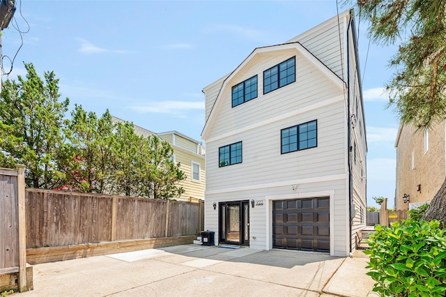 923 Oceanfront, Long Beach, NY 11561 - view of front of property featuring driveway and a garage