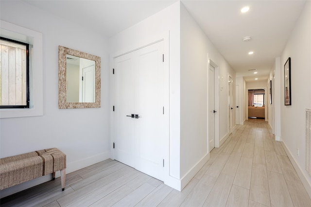923 Oceanfront, Long Beach, NY 11561 - hallway featuring light wood finished floors, recessed lighting, and baseboards