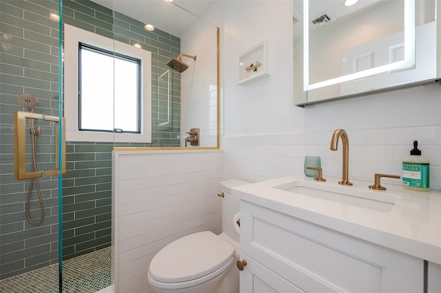 923 Oceanfront, Long Beach, NY 11561 - full bathroom with tile walls, a walk in shower, vanity, toilet, and wainscoting