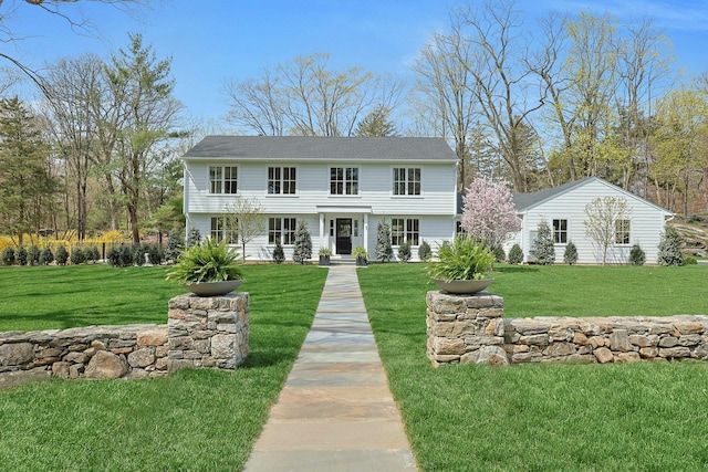 colonial inspired home with a front yard