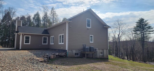 view of side of property featuring a chimney