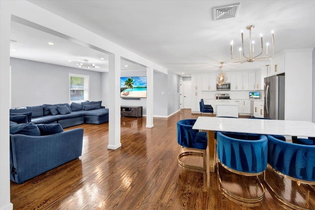 interior space featuring an inviting chandelier, visible vents, dark wood-style flooring, baseboards, and recessed lighting