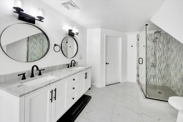 bathroom with a sink, visible vents, a stall shower, and marble finish floor