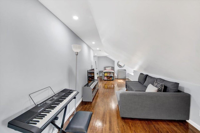 living room with vaulted ceiling, recessed lighting, and wood finished floors