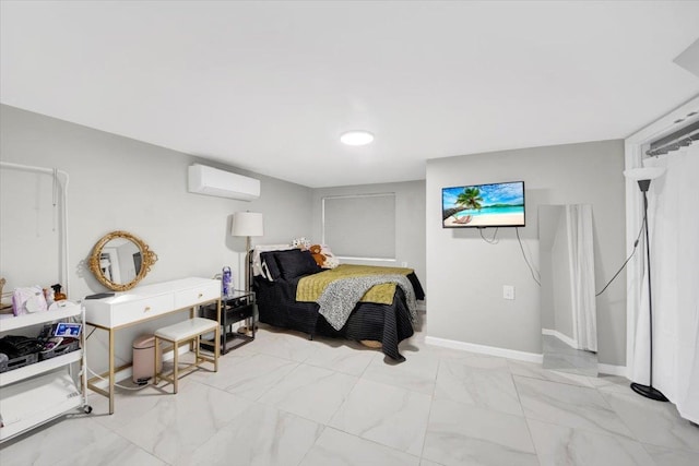 bedroom featuring baseboards, marble finish floor, and a wall unit AC