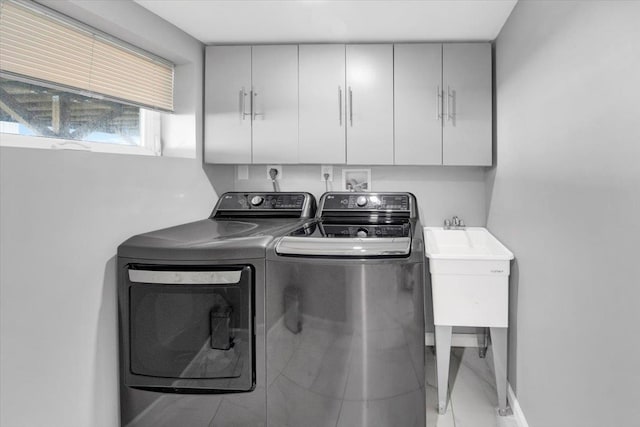laundry area featuring cabinet space and washing machine and dryer