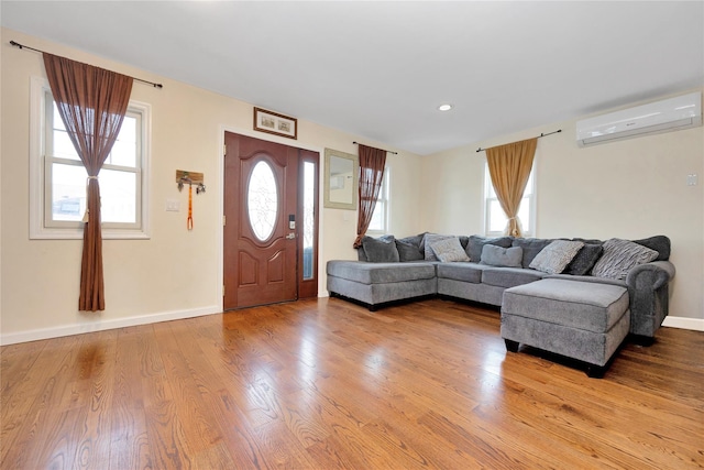 71 E Kissimee Rd, Lindenhurst, NY 11757 - living area with recessed lighting, baseboards, light wood finished floors, and a wall unit AC
