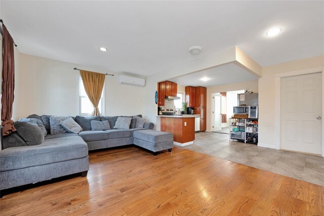 71 E Kissimee Rd, Lindenhurst, NY 11757 - living room with recessed lighting, a wall mounted AC, and light wood finished floors