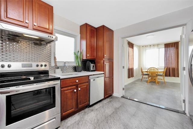 71 E Kissimee Rd, Lindenhurst, NY 11757 - kitchen featuring a sink, dishwasher, stainless steel range with electric stovetop, light countertops, and under cabinet range hood