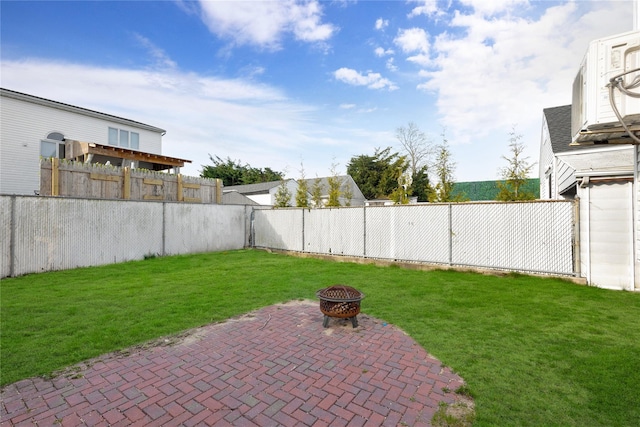71 E Kissimee Rd, Lindenhurst, NY 11757 - view of yard featuring a fenced backyard, a fire pit, and a patio