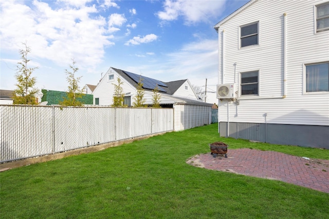 71 E Kissimee Rd, Lindenhurst, NY 11757 - view of yard featuring fence, an outdoor fire pit, ac unit, and a patio