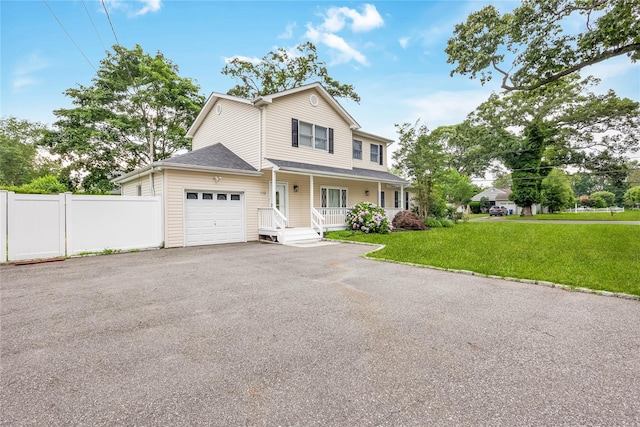 110 Saint Marks Ln, Islip, NY 11751 - view of front of house with covered porch, a garage, and driveway