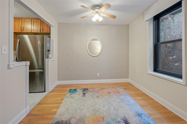 45 Overlook Ter Unit 5A, New York Manhattan, NY 10033 - unfurnished dining area with light wood finished floors, a ceiling fan, and baseboards