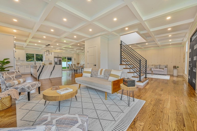 296 Division Ave, Hicksville, NY 11801 - living area featuring coffered ceiling, light wood-style floors, stairs, beamed ceiling, and recessed lighting