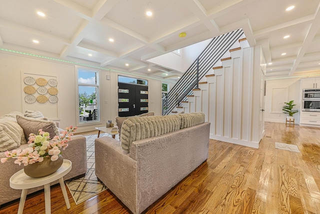 296 Division Ave, Hicksville, NY 11801 - living room featuring coffered ceiling, stairs, light wood-type flooring, beamed ceiling, and recessed lighting