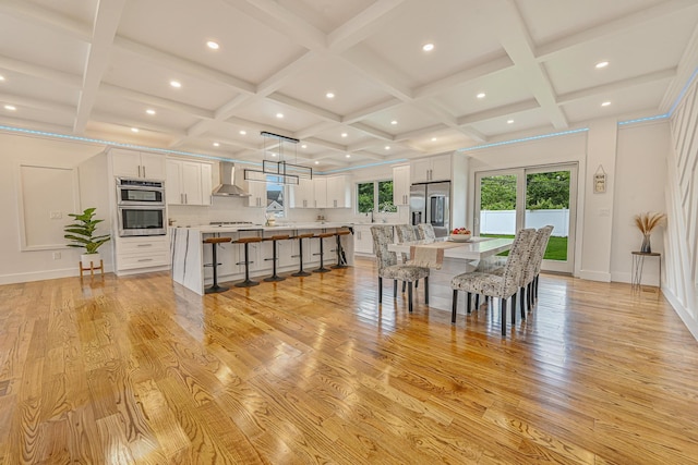 296 Division Ave, Hicksville, NY 11801 - dining space with coffered ceiling, light wood-style flooring, beamed ceiling, and recessed lighting