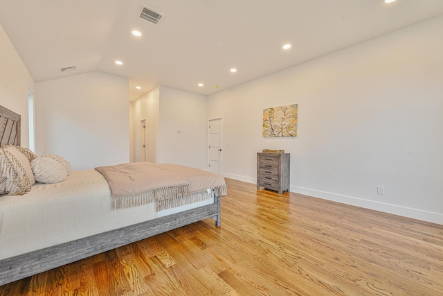 296 Division Ave, Hicksville, NY 11801 - bedroom with recessed lighting, light wood finished floors, baseboards, and vaulted ceiling