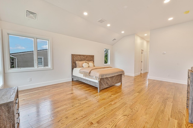 296 Division Ave, Hicksville, NY 11801 - bedroom with light wood finished floors, recessed lighting, baseboards, and vaulted ceiling