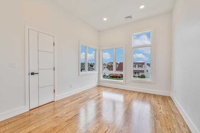 296 Division Ave, Hicksville, NY 11801 - unfurnished room featuring light wood-type flooring, baseboards, and recessed lighting
