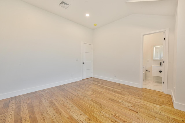 296 Division Ave, Hicksville, NY 11801 - unfurnished room featuring lofted ceiling, light wood-style flooring, and baseboards