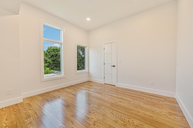 296 Division Ave, Hicksville, NY 11801 - unfurnished room with baseboards, light wood-style flooring, and recessed lighting