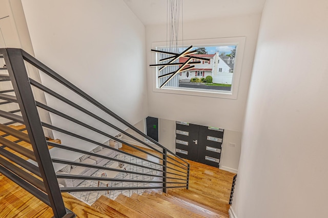 296 Division Ave, Hicksville, NY 11801 - stairs featuring wood finished floors and baseboards