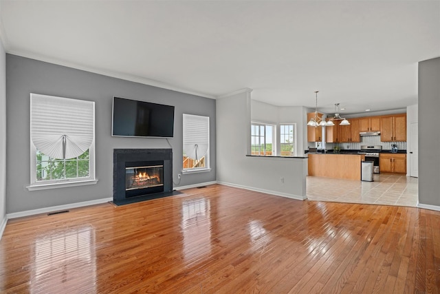 2066 Independence Dr, New Windsor, NY 12553 - unfurnished living room with a fireplace with flush hearth and light wood-type flooring