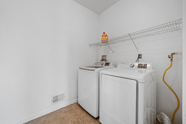 2066 Independence Dr, New Windsor, NY 12553 - laundry room featuring washing machine and clothes dryer and baseboards