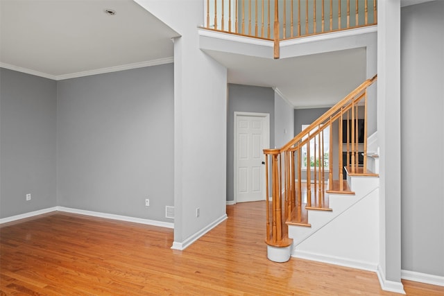 2066 Independence Dr, New Windsor, NY 12553 - stairway featuring crown molding and wood finished floors