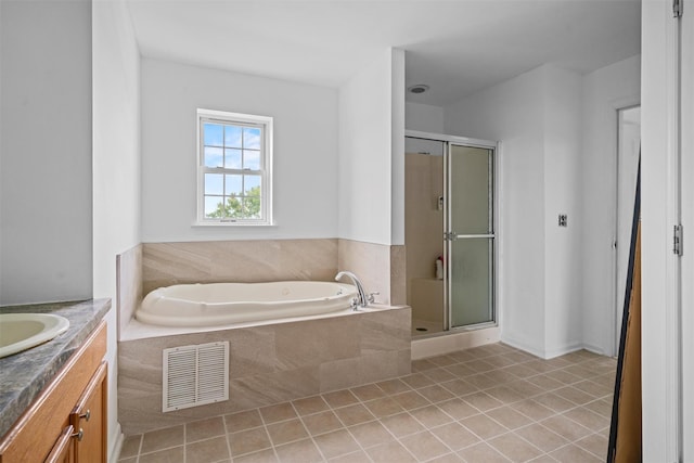 2066 Independence Dr, New Windsor, NY 12553 - full bath featuring a bath, vanity, a shower stall, and tile patterned floors