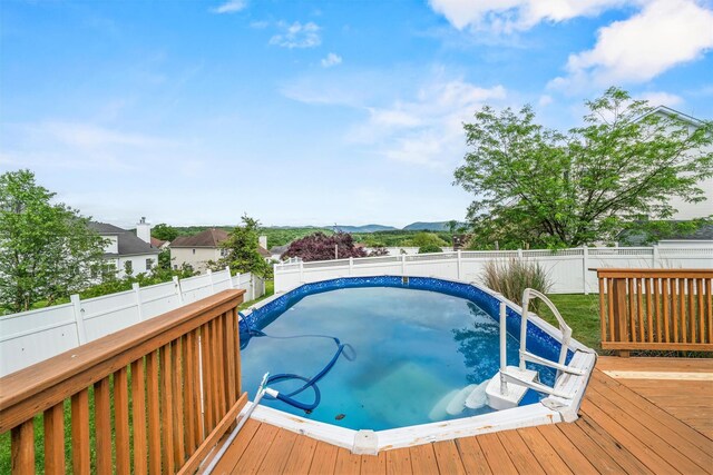 2066 Independence Dr, New Windsor, NY 12553 - view of swimming pool featuring a wooden deck and a fenced backyard