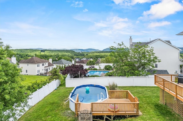 2066 Independence Dr, New Windsor, NY 12553 - view of swimming pool featuring a deck with mountain view and a fenced backyard