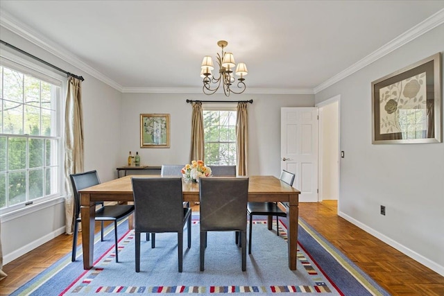 dining area with baseboards, a chandelier, and a wealth of natural light