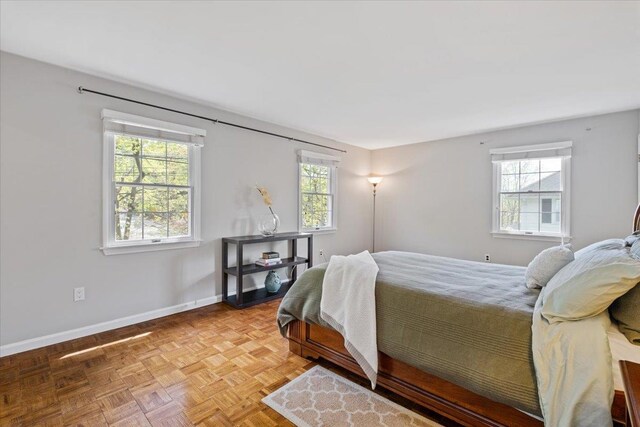bedroom featuring baseboards