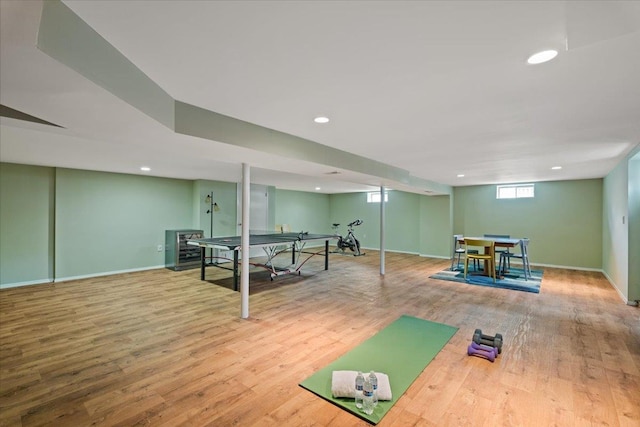exercise room featuring baseboards, recessed lighting, and wood finished floors